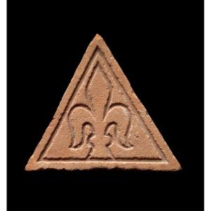 A German Floortile With Fleur-de-lis Decoration