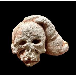 Large Memento Mori Skull Supported By A Hand, Carved Stone, 16th-17th Century