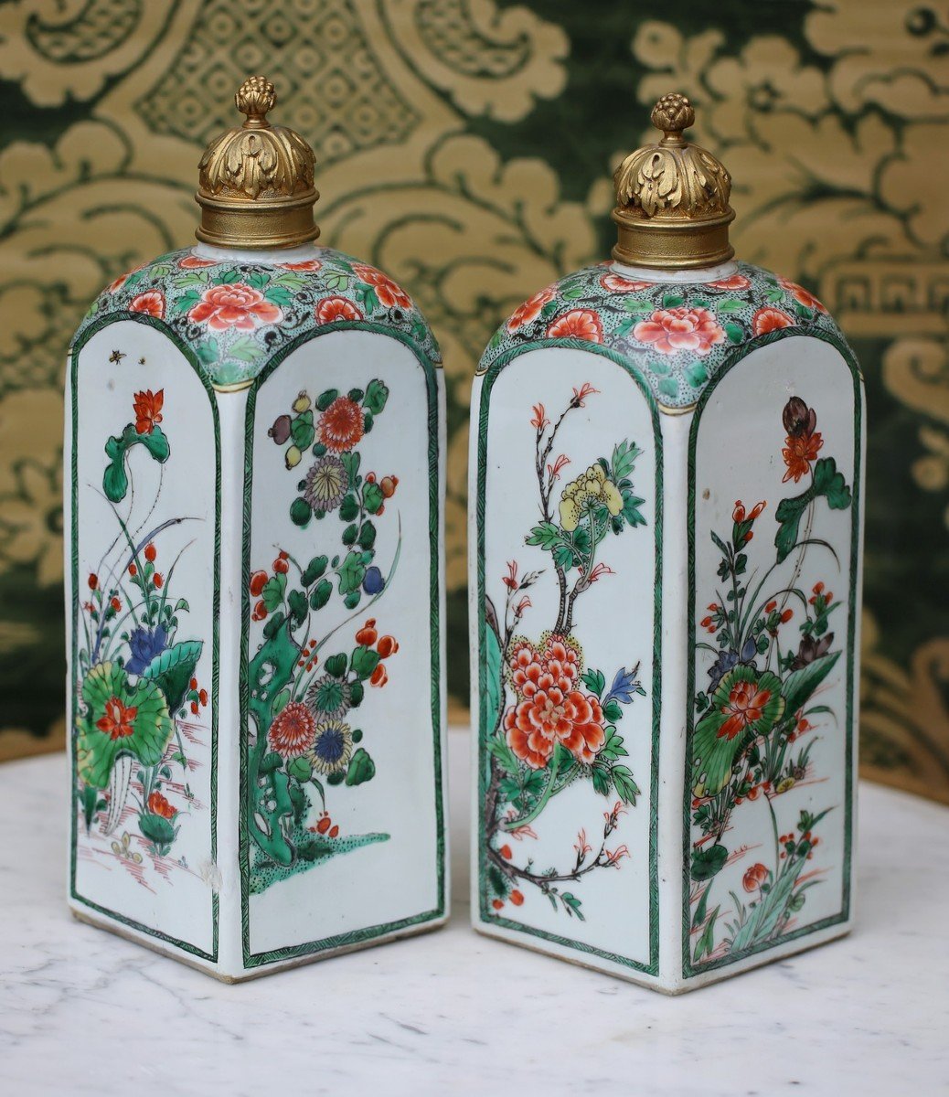 China Kangxi Period Pair Of Square Famille Verte Bottles, Later Gilt Bronze Stoppers.