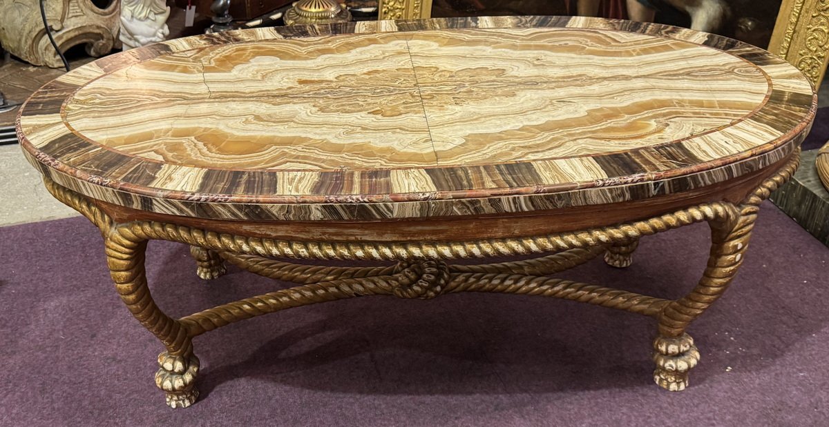 Table basse en bois doré décor de cordage noué, plateau plaqué onyx, Italie début XX