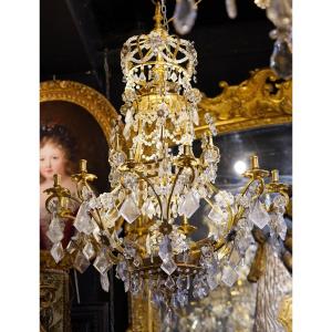 Italie époque début XVIIIème, lustre en métal doré et cristaux de roche.