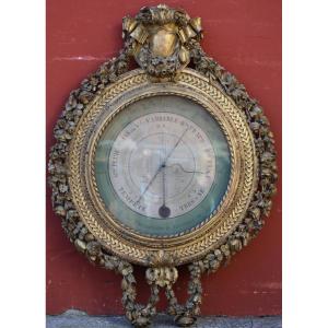 Baromètre thermomètre modèle de Réaumur,en bois doré richement sculpté,époque Louis XVI