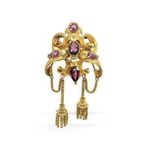 Broche en or 18 carats avec grenats.  