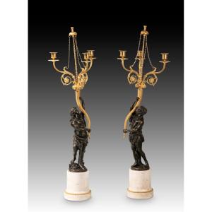 Pair Of Candlesticks. Marble, Gilded And Patinated Bronze. Based On Designs By Clodion