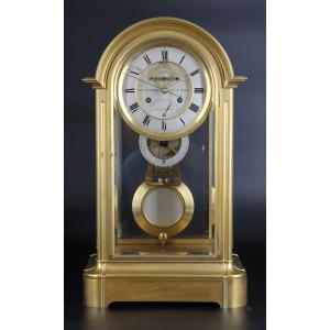 Pendule CAGE VITRÉE EN BRONZE DORÉ avec echappement visible, date et equation du temp